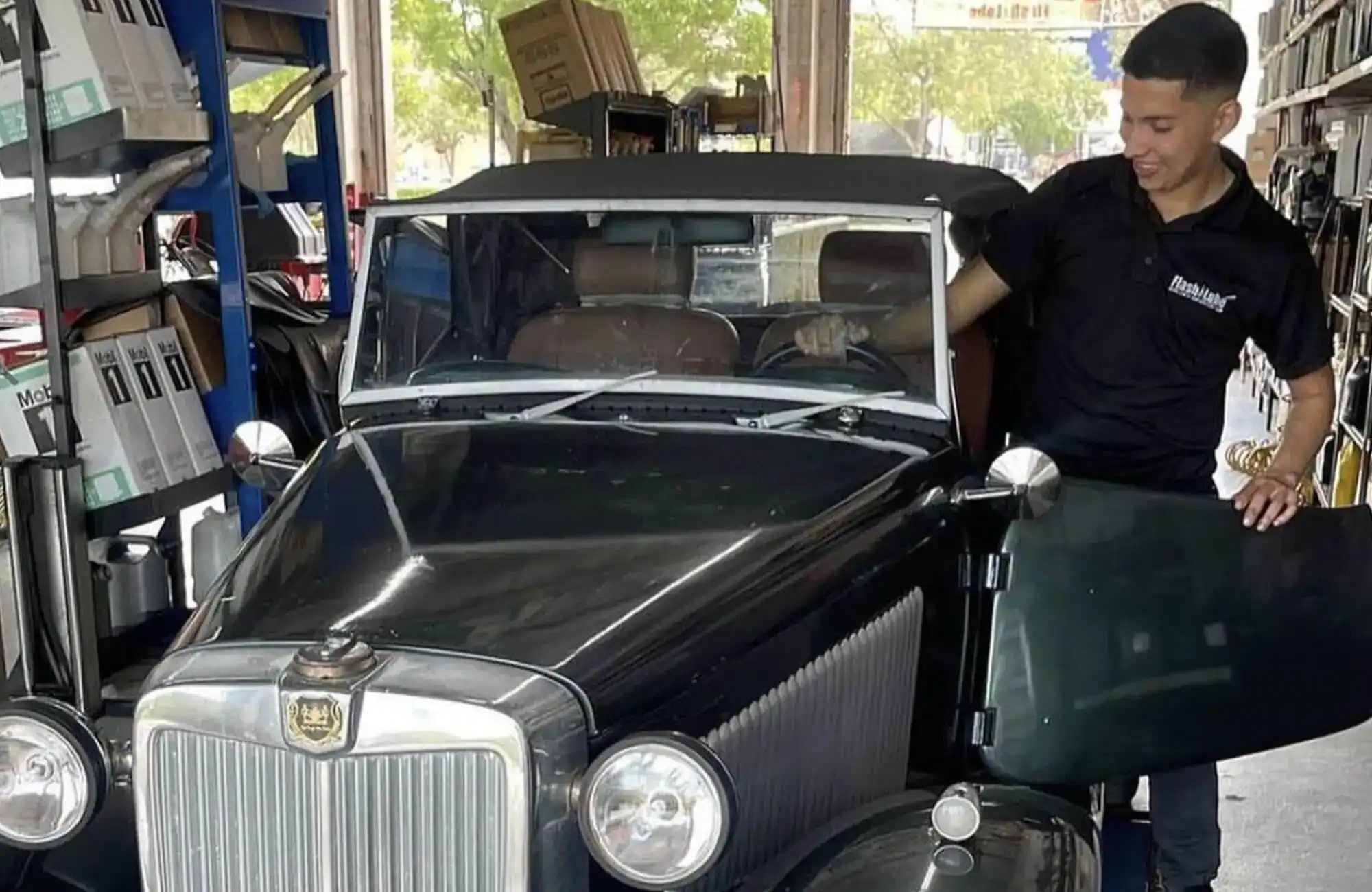 man with old car